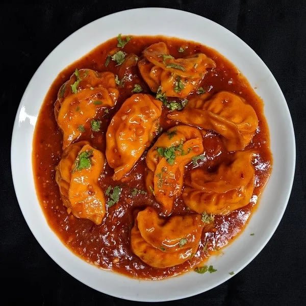 Chilli momos with gravi 8pcs